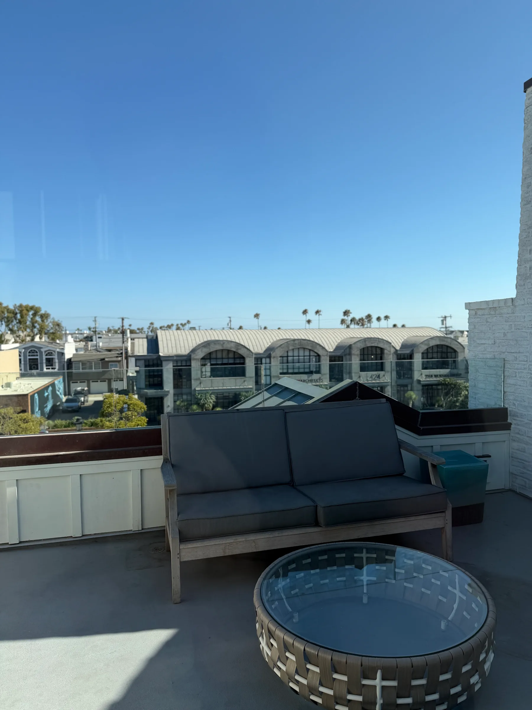 Private rooftop deck with a couch overlooking the Lido peninsula